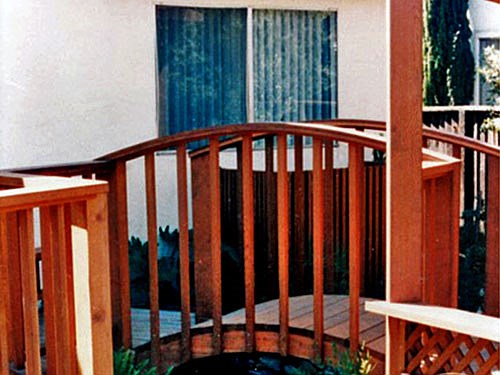 Bridge This cute bridge covers a dry stream bed. To make the arc, bender boards were used with glue and screws.
